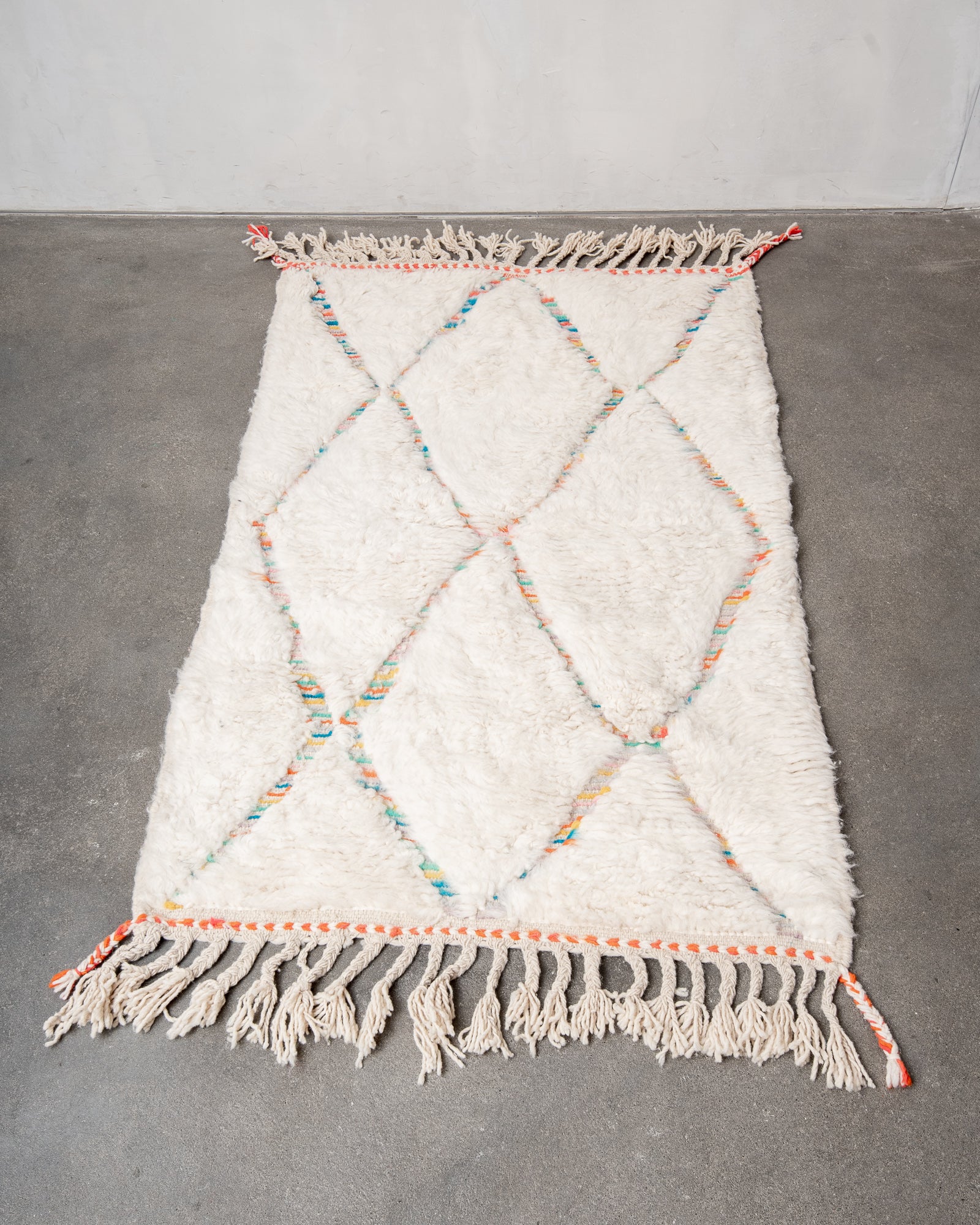 Modern, designer, handcrafted Berber rug from Morocco. Beniourain carpet with beautiful colours and patterns and fluffy wool texture.